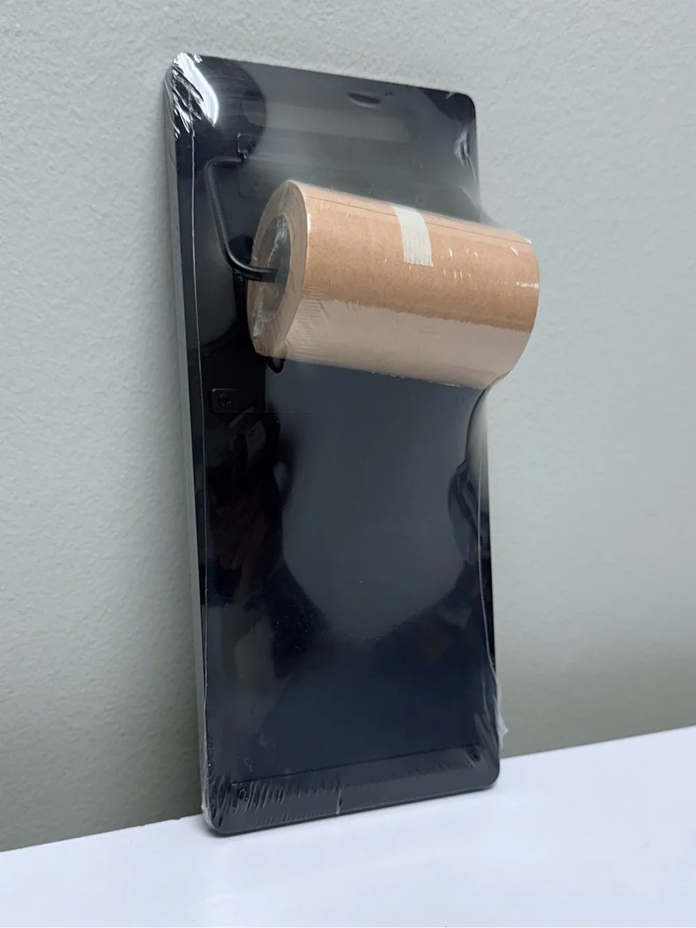 Black Tablet Stand with Brown Paper Roll Dispenser Target Bullseye’s Playground